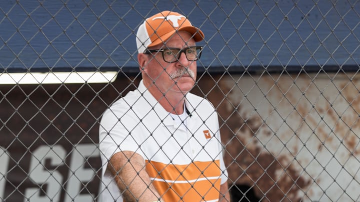 Texas Longhorns head coach Mike White watches the Texas Tech Red Raiders warm up.