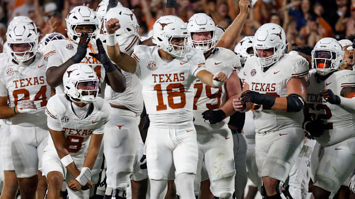 Texas Longhorns quarterback Matthew Caldwell reacts with teammates after a touchdown review during overtime against the Mississippi State Bulldogs 