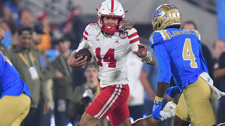 Nebraska quarterback TJ Lateef runs the ball against the UCLA Bruins at the Rose Bowl. Nebraska quarterback TJ Lateef runs the ball against the UCLA Bruins at the Rose Bowl.