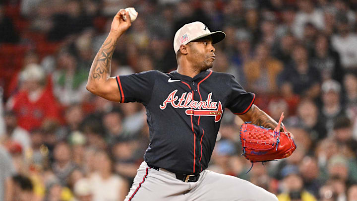 May 16, 2025; Boston, Massachusetts, USA; Atlanta Braves relief pitcher Raisel Iglesias (26) throws against the Boston Red Sox during the ninth inning at Fenway Park. Mandatory Credit: Eric Canha-Imagn Images