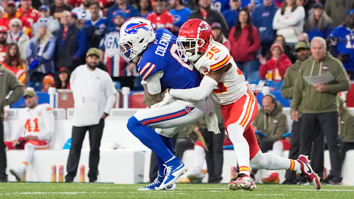 Nov 2, 2025; Orchard Park, New York, USA; Buffalo Bills wide receiver Keon Coleman (0) is brought down by Kansas City Chiefs cornerback Jaylen Watson (35) in the second quarter at Highmark Stadium.