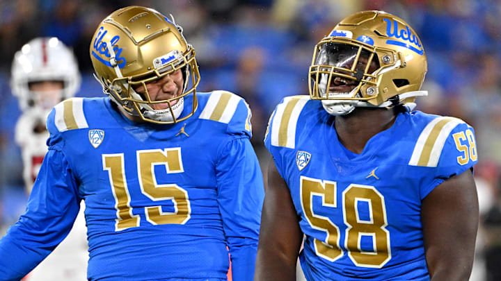 Oct 29, 2022; Pasadena, California, USA; UCLA Bruins linebacker Laiatu Latu (15) and defensive lineman Gary Smith III (58) celebrate after a sack of Stanford Cardinal quarterback Tanner McKee (18) in the first half at the Rose Bowl. Mandatory Credit: Jayne Kamin-Oncea-Imagn Images Oct 29, 2022; Pasadena, California, USA; UCLA Bruins linebacker Laiatu Latu (15) and defensive lineman Gary Smith III (58) celebrate after a sack of Stanford Cardinal quarterback Tanner McKee (18) in the first half at the Rose Bowl. Mandatory Credit: Jayne Kamin-Oncea-Imagn Images
