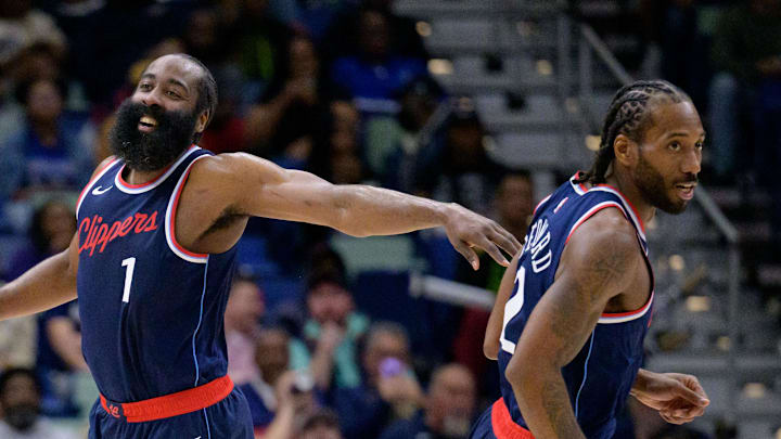 Mar 11, 2025; New Orleans, Louisiana, USA; Los Angeles Clippers forward Kawhi Leonard (2) and Los Angeles Clippers guard James Harden (1) react  during the second half against the New Orleans Pelicans at Smoothie King Center. Mandatory Credit: Matthew Hinton-Imagn Images