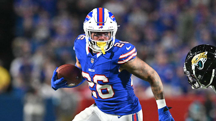 Sep 23, 2024; Orchard Park, New York, USA; Buffalo Bills running back Ty Johnson (26) runs against Jacksonville Jaguars cornerback De'Antre Prince (24) in the fourth quarter at Highmark Stadium.