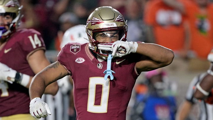 Nov 11, 2023; Tallahassee, Florida, USA; Florida State Seminoles wide receiver Ja'Khi Douglas (0) celebrates a big play against the Miami Hurricanes in the second half at Doak S. Campbell Stadium. Mandatory Credit: Melina Myers-Imagn Images
