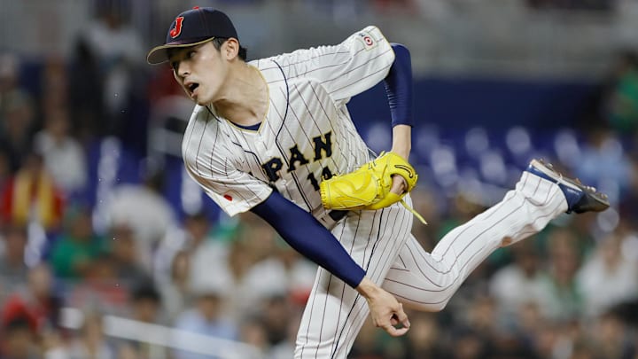 Mar 20, 2023; Miami, Florida, USA; Japan starting pitcher Roki Sasaki (14) delivers a pitch during the first inning against Mexico at LoanDepot Park