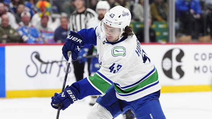 Dec 2, 2025; Denver, Colorado, USA; Vancouver Canucks defenseman Quinn Hughes (43) takes a shot on goal in the third period against the Colorado Avalanche at Ball Arena. Mandatory Credit: Ron Chenoy-Imagn Images Dec 2, 2025; Denver, Colorado, USA; Vancouver Canucks defenseman Quinn Hughes (43) takes a shot on goal in the third period against the Colorado Avalanche at Ball Arena. Mandatory Credit: Ron Chenoy-Imagn Images