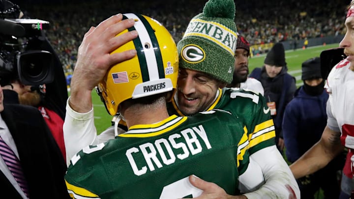 Green Bay Packers quarterback Aaron Rodgers (12) congratulates Mason Crosby on his game-winning field goal against the 49ers. Green Bay Packers quarterback Aaron Rodgers (12) congratulates Mason Crosby on his game-winning field goal against the 49ers.
