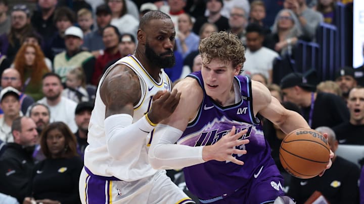 Nov 23, 2025; Salt Lake City, Utah, USA; Utah Jazz forward Lauri Markkanen (23) drives against Los Angeles Lakers forward LeBron James (23) during the second half at Delta Center. Nov 23, 2025; Salt Lake City, Utah, USA; Utah Jazz forward Lauri Markkanen (23) drives against Los Angeles Lakers forward LeBron James (23) during the second half at Delta Center.