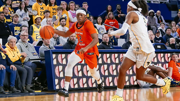 Illinois guard Destiny Jackson (2) blows past a Michigan defender in the Illini's 85-69 loss to the Wolverines on Thursday at the Crisler Center in Ann Arbor, Michigan.