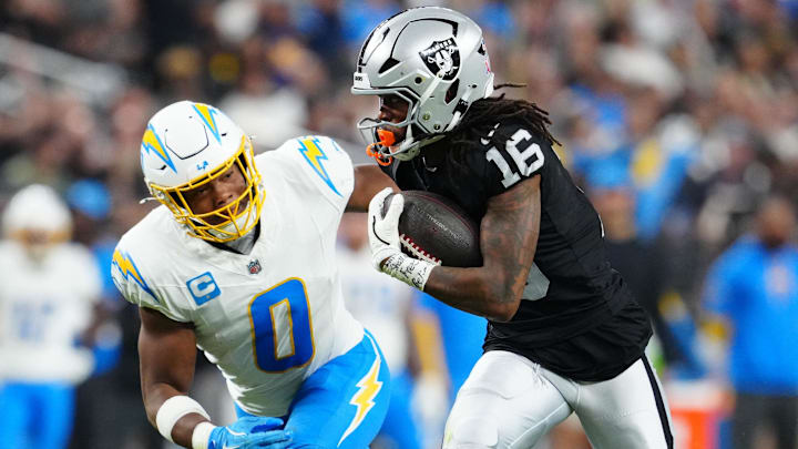 Sep 15, 2025; Paradise, Nevada, USA; Las Vegas Raiders wide receiver Jakobi Meyers (16) rushes as Los Angeles Chargers linebacker Daiyan Henley (0) defends at Allegiant Stadium. Mandatory Credit: Stephen R. Sylvanie-Imagn Images Sep 15, 2025; Paradise, Nevada, USA; Las Vegas Raiders wide receiver Jakobi Meyers (16) rushes as Los Angeles Chargers linebacker Daiyan Henley (0) defends at Allegiant Stadium. Mandatory Credit: Stephen R. Sylvanie-Imagn Images