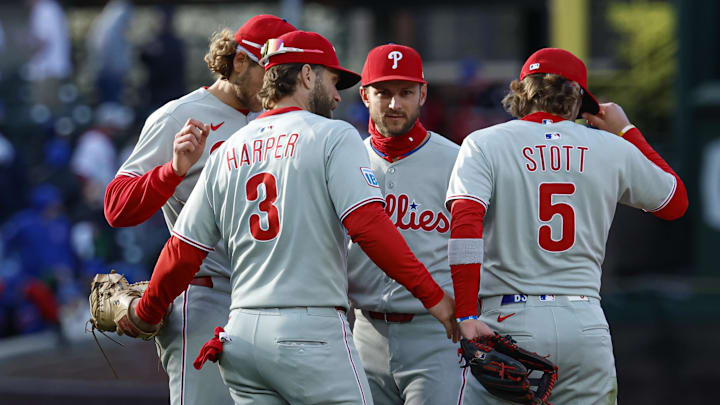 Apr 26, 2025; Chicago, Illinois, USA; Philadelphia Phillies players celebrate after defeating the Chicago Cubs in a baseball game at Wrigley Field