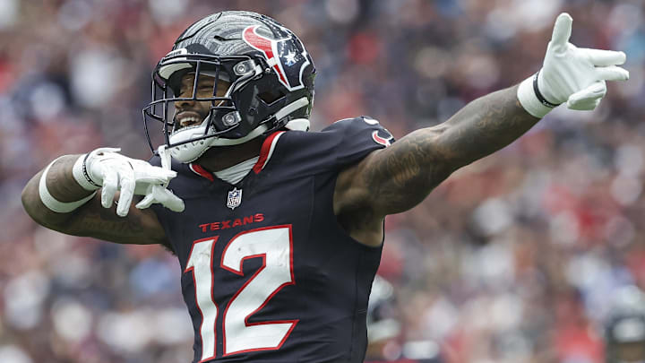 Sep 29, 2024; Houston, Texas, USA; Houston Texans wide receiver Nico Collins (12) signals after a first down during the first quarter against the Jacksonville Jaguars at NRG Stadium. Mandatory Credit: Troy Taormina-Imagn Images