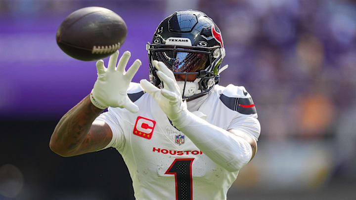 Sep 22, 2024; Minneapolis, Minnesota, USA; Houston Texans wide receiver Stefon Diggs (1) warms up before the game against the Minnesota Vikings at U.S. Bank Stadium. Mandatory Credit: Brad Rempel-Imagn Images