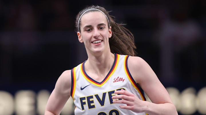 Indiana Fever guard Caitlin Clark reacts after making a basket.