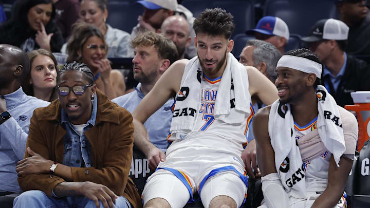 Nov 12, 2025; Oklahoma City, Oklahoma, USA; Oklahoma City Thunder guard Jalen Williams (8), center Chet Holmgren (7), and guard Shai Gilgeous-Alexander (2) talk while sitting on the bench during the fourth quarter against the Los Angeles Lakers at Paycom Center. Mandatory Credit: Alonzo Adams-Imagn Images Nov 12, 2025; Oklahoma City, Oklahoma, USA; Oklahoma City Thunder guard Jalen Williams (8), center Chet Holmgren (7), and guard Shai Gilgeous-Alexander (2) talk while sitting on the bench during the fourth quarter against the Los Angeles Lakers at Paycom Center. Mandatory Credit: Alonzo Adams-Imagn Images