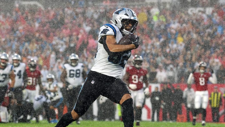 Jan 3, 2026; Tampa, Florida, USA; Carolina Panthers tight end Tommy Tremble (82) runs to score a touchdown against the Tampa Bay Buccaneers in the first half at Raymond James Stadium. Mandatory Credit: Nathan Ray Seebeck-Imagn Images Jan 3, 2026; Tampa, Florida, USA; Carolina Panthers tight end Tommy Tremble (82) runs to score a touchdown against the Tampa Bay Buccaneers in the first half at Raymond James Stadium. Mandatory Credit: Nathan Ray Seebeck-Imagn Images