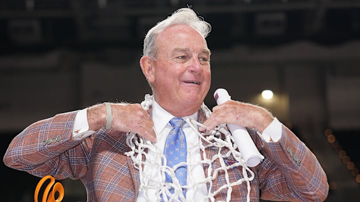Mar 8, 2026; Greenville, SC, USA; Texas Longhorns head coach Vic Schaefer cuts the net after his team wins the SEC Championship over South Carolina at Bon Secours Wellness Arena. Mandatory Credit: Jim Dedmon-Imagn Images