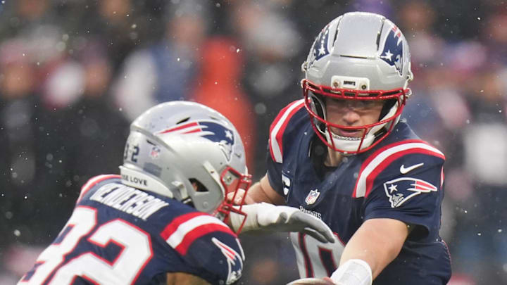 Jan 18, 2026; Foxborough, MA, USA; New England Patriots quarterback Drake Maye (10) hands the ball to  running back TreVeyon Henderson (32) in the second quarter against the Houston Texans in an AFC Divisional Round game at Gillette Stadium. Mandatory Credit: David Butler II-Imagn Images