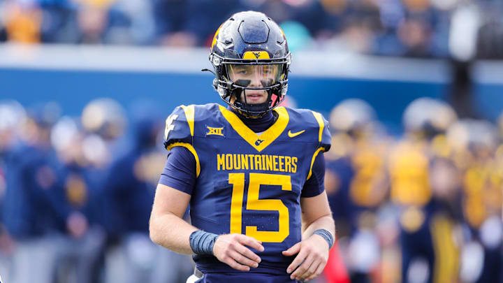 Nov 29, 2025; Morgantown, West Virginia, USA; West Virginia Mountaineers quarterback Scotty Fox Jr. (15) on the field during the second quarter against the Texas Tech Red Raiders at Milan Puskar Stadium. Mandatory Credit: Ben Queen-Imagn Images