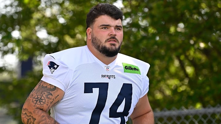 Former New England Patriots offensive lineman Jack Conley (74) walks to the practice field for Patriots training camp