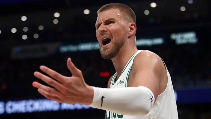 Mar 31, 2025; Memphis, Tennessee, USA; Boston Celtics center Kristaps Porzingis (8) reacts during the first quarter against the Memphis Grizzlies at FedExForum. Mandatory Credit: Petre Thomas-Imagn Images