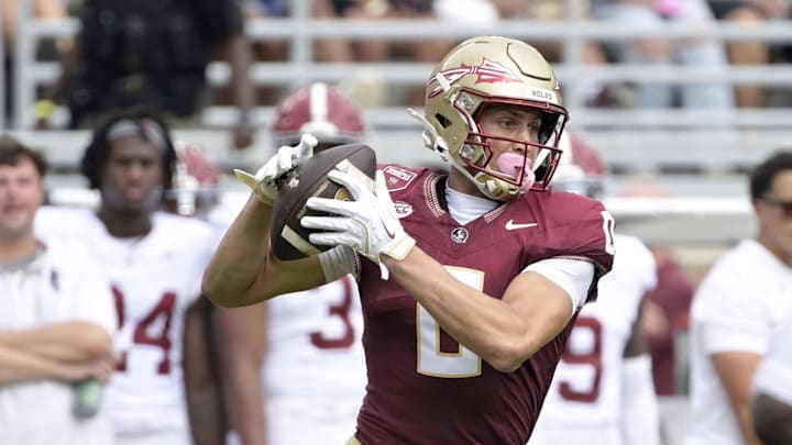 Aug 30, 2025; Tallahassee, Florida, USA; Florida State Seminoles wide receiver Duce Robinson (0) makes a catch against the Alabama Crimson Tide during the first half at Doak S. Campbell Stadium. Mandatory Credit: Melina Myers-Imagn Images