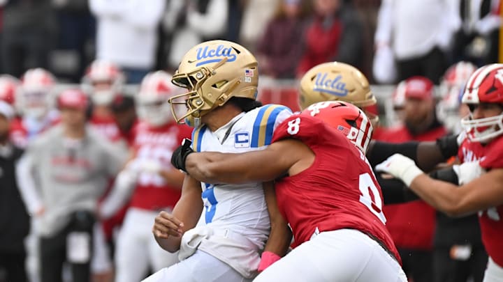 Oct 25, 2025; Bloomington, Indiana, USA; Indiana Hoosiers defensive lineman Stephen Daley (8) pressures UCLA Bruins quarterback Nico Iamaleava (9) as he throws during the first half at Memorial Stadium. Mandatory Credit: Robert Goddin-Imagn Images