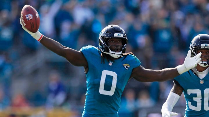 Jacksonville Jaguars linebacker Devin Lloyd (0) reacts to a fumble recovery next to cornerback Montaric Brown (30) during the second quarter of an NFL football AFC Wild Card playoff matchup, Sunday, Jan. 11, 2026, in Jacksonville, Fla. The Bills defeated the Jaguars 27-24. [Corey Perrine/Florida Times-Union]
