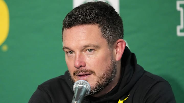 Nov 16, 2024; Madison, Wisconsin, USA;  Oregon Ducks head coach Dan Lanning talks to the media during the post game press conference following the game against the Wisconsin Badgers at Camp Randall Stadium. Mandatory Credit: Jeff Hanisch-Imagn Images