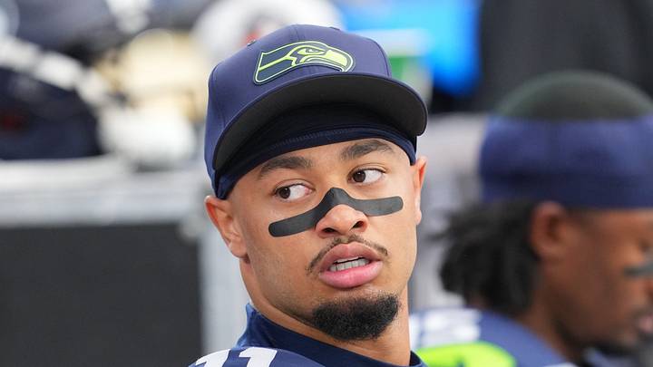 Seattle Seahawks wide receiver Jaxon Smith-Njigba looks on from the sideline