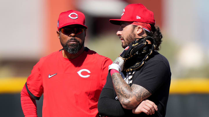 Feb 19, 2024; Goodyear, AZ, USA; Cincinnati Reds special assistant Barry Larkin talks with infielder Jonathan India during spring training workouts at Goodyear Ballpark. Mandatory Credit: Kareem Elgazzar-Imagn Images