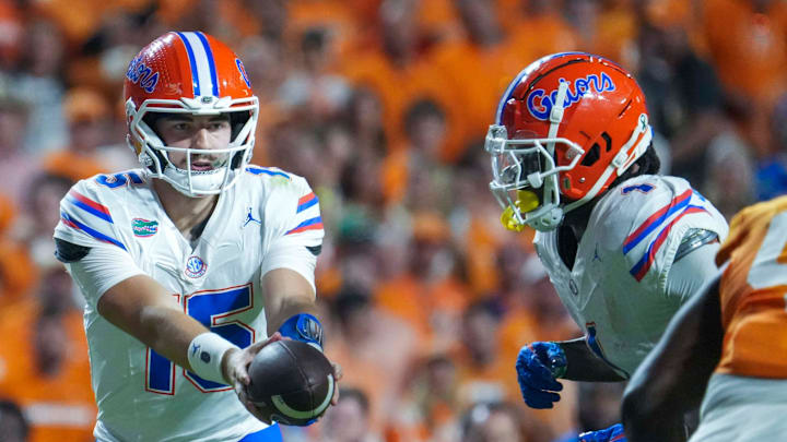 Florida quarterback Graham Mertz (15) hands the ball to Florida running back Montrell Johnson Jr. (1) during a NCAA football game between Tennessee and Florida in Neyland Stadium, in Knoxville, Tenn., Oct. 12, 2024. Florida quarterback Graham Mertz (15) hands the ball to Florida running back Montrell Johnson Jr. (1) during a NCAA football game between Tennessee and Florida in Neyland Stadium, in Knoxville, Tenn., Oct. 12, 2024.