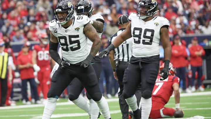 Nov 26, 2023; Houston, Texas, USA;Jacksonville Jaguars defensive end Roy Robertson-Harris (95) reacts after sacking Houston Texans quarterback C.J. Stroud (7) in the first quarter at NRG Stadium. Mandatory Credit: Thomas Shea-Imagn Images
