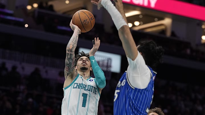 Oct 30, 2025; Charlotte, North Carolina, USA; Charlotte Hornets guard LaMelo Ball (1) drives to the basket against Orlando Magic center Goga Bitadze (35) during the second half at Spectrum Center. Mandatory Credit: Jim Dedmon-Imagn Images
