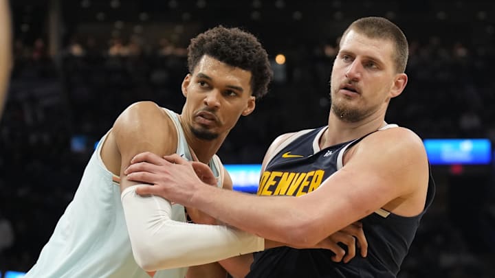 Jan 4, 2025; San Antonio, Texas, USA; San Antonio Spurs center Victor Wembanyama (1) and Denver Nuggets center Nikola Jokic (15) battle for position during an inbound pass in the second half at Frost Bank Center.