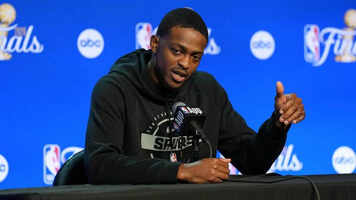 Jun 2, 2026; San Antonio, TX, USA;  San Antonio Spurs guard De'Aaron Fox (4) talks to the press during media day for the 2026 NBA Finals at Frost Bank Center. Mandatory Credit: Daniel Dunn-Imagn Images