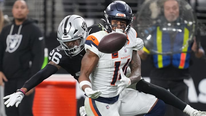 Dec 7, 2025; Paradise, Nevada, USA; Las Vegas Raiders cornerback Darien Porter (26) breaks up the pass to Denver Broncos wide receiver Courtland Sutton (14) during the second half at Allegiant Stadium. Mandatory Credit: Kirby Lee-Imagn Images Dec 7, 2025; Paradise, Nevada, USA; Las Vegas Raiders cornerback Darien Porter (26) breaks up the pass to Denver Broncos wide receiver Courtland Sutton (14) during the second half at Allegiant Stadium. Mandatory Credit: Kirby Lee-Imagn Images