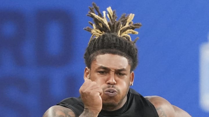 Texas A&M defensive lineman Cashius Howell runs the 40-yard dash.