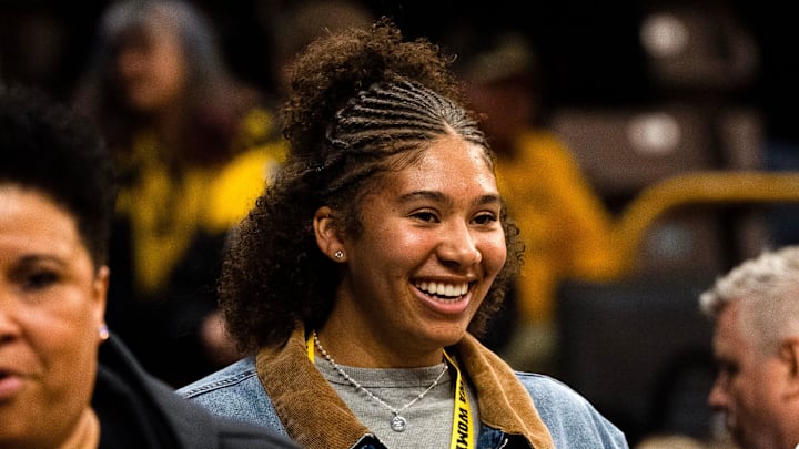 Iowa women’s basketball recruit Nation Williams talks to Iowa guard Taylor Stremlow (1) after the Hawkeyes basketball game against the Michigan Wolverines Feb. 22, 2026 at Carver-Hawkeye Arena in Iowa City, Iowa.