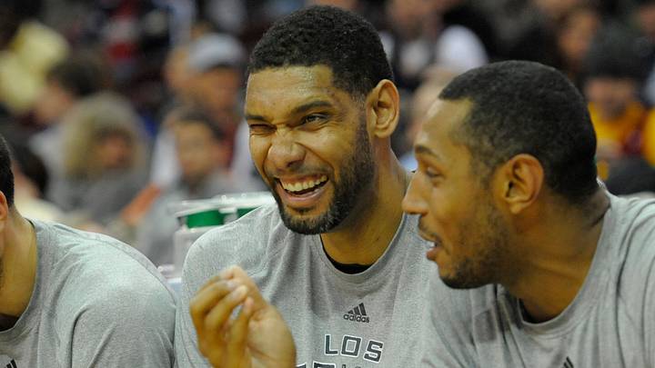 Mar 4, 2014; Cleveland, OH, USA; San Antonio Spurs shooting guard Manu Ginobili (left), power forward Tim Duncan (center) and power forward Boris Diaw (33) laugh on the bench in the fourth quarter of a 122-101 win over the Cleveland Cavaliers at Quicken Loans Arena. Mandatory Credit: David Richard-USA TODAY Sports