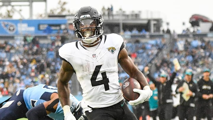 Dec 8, 2024; Nashville, Tennessee, USA;  Jacksonville Jaguars running back Tank Bigsby (4) runs the ball and scores a touchdown against the Tennessee Titans during the second half at Nissan Stadium. Mandatory Credit: Steve Roberts-Imagn Images