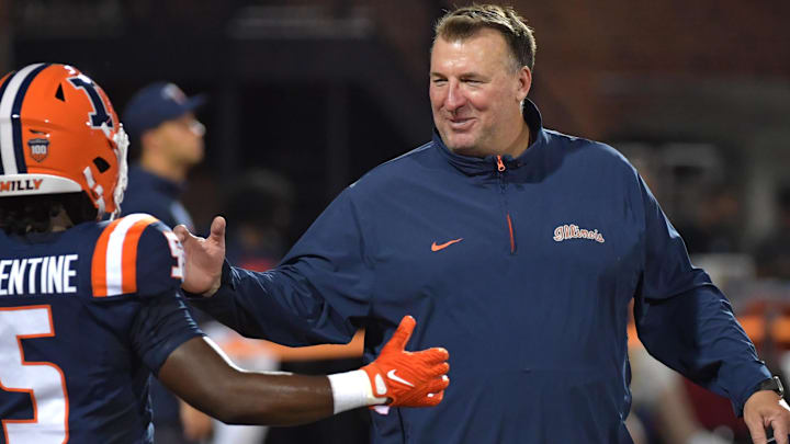 Aug 29, 2024; Champaign, Illinois, USA;  Illinois Fighting Illini head coach Bret Bielema greets running back Ca'Lil Valentine (5) before the first half at Memorial Stadium. Mandatory Credit: Ron Johnson-Imagn Images