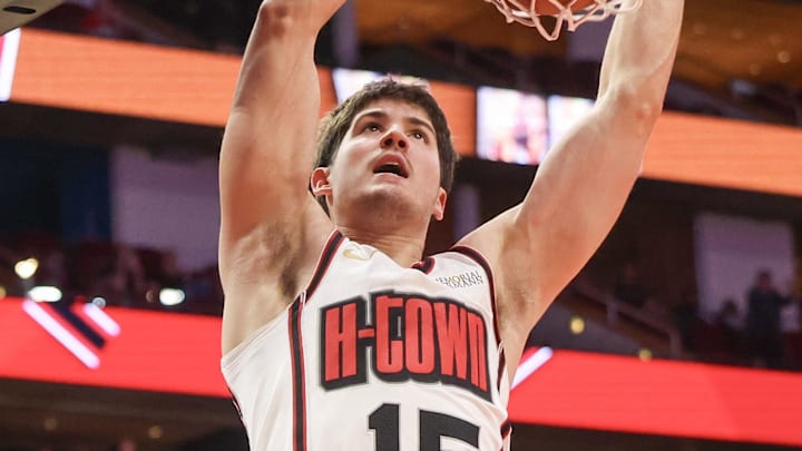 Feb 12, 2025; Houston, Texas, USA; Houston Rockets guard Reed Sheppard (15) dunks against the Phoenix Suns in the second half at Toyota Center. Mandatory Credit: Thomas Shea-Imagn Images