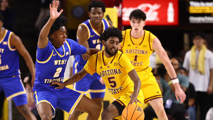 Jan 21, 2026; Tempe, Arizona, USA; Arizona State Sun Devils guard Maurice Odum (5) against West Virginia Mountaineers guard Amir Jenkins (2) in the first half at Desert Financial Arena. Mandatory Credit: Mark J. Rebilas-Imagn Images