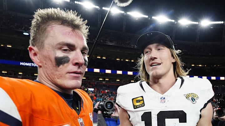 Dec 21, 2025; Denver, Colorado, USA; Denver Broncos quarterback Bo Nix (10) and Jacksonville Jaguars quarterback Trevor Lawrence (16) meet after the game at Empower Field at Mile High. Mandatory Credit: Ron Chenoy-Imagn Images