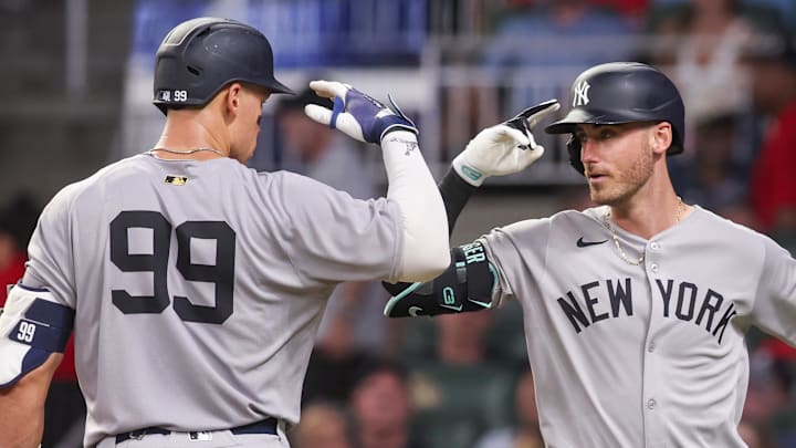Jul 19, 2025; Atlanta, Georgia, USA; New York Yankees left fielder Cody Bellinger (35) celebrates with right fielder Aaron Judge (99) after a home run against the Atlanta Braves in the seventh inning at Truist Park. Mandatory Credit: Brett Davis-Imagn Images