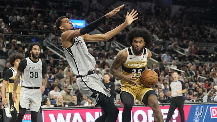 Dec 18, 2025; San Antonio, Texas, USA; Washington Wizards forward Marvin Bagley III (35) draws a foul from San Antonio Spurs forward Victor Wembanyama (1) during the second half at Frost Bank Center. Mandatory Credit: Scott Wachter-Imagn Images Dec 18, 2025; San Antonio, Texas, USA; Washington Wizards forward Marvin Bagley III (35) draws a foul from San Antonio Spurs forward Victor Wembanyama (1) during the second half at Frost Bank Center. Mandatory Credit: Scott Wachter-Imagn Images
