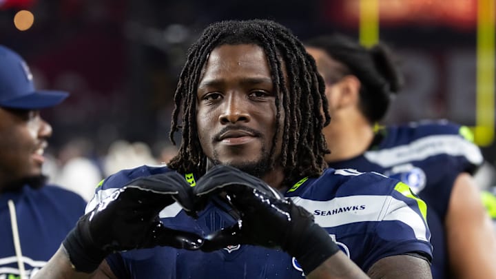 Seattle Seahawks linebacker Tyrice Knight makes the sign of a heart
