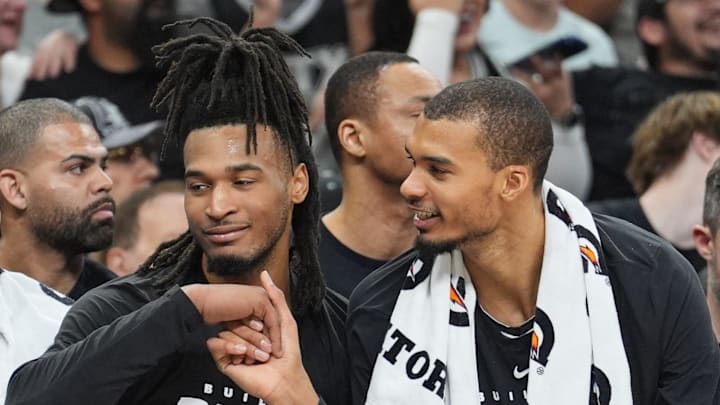 Feb 7, 2026; San Antonio, Texas, USA;  San Antonio Spurs forward Victor Wembanyama (1) shakes the hand of guard Stephon Castle (5) during the second half against Dallas Mavericks at Frost Bank Center. Mandatory Credit: Daniel Dunn-Imagn Images